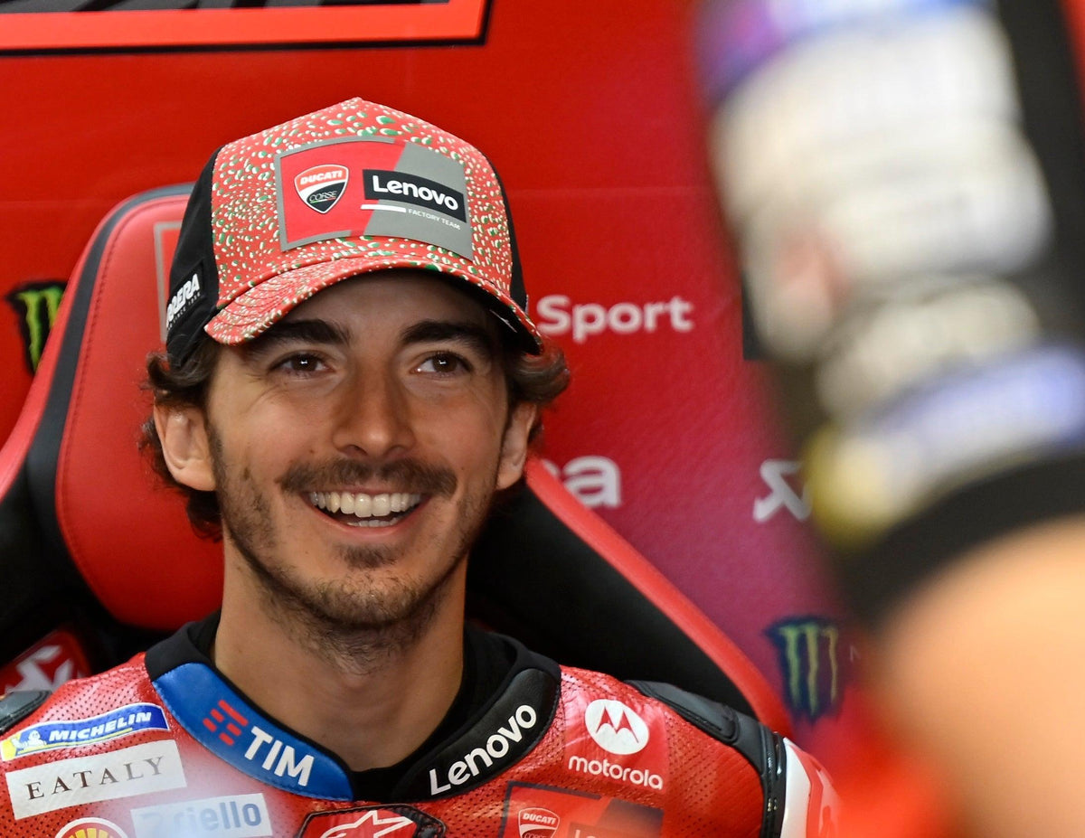 Francesco Bagnaia smiling in the paddock