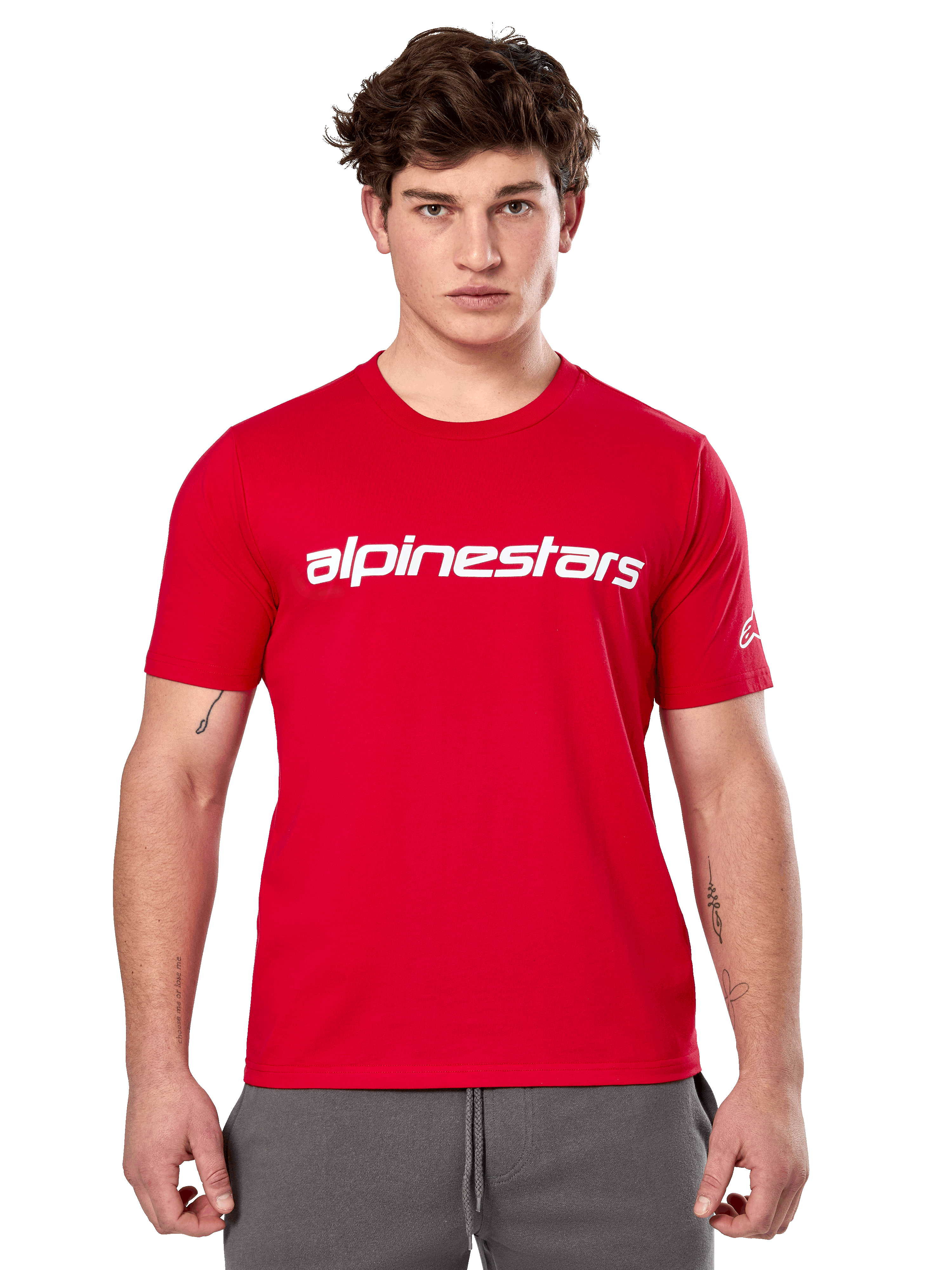 Alpinestars Linear Wordmark 2.0 CSF Tee, Short Sleeve T-Shirt, Red, White linear wordmark on chest and Ageless logo on sleeve, worn by male model with gray sweatpants, casual motorsport-inspired streetwear