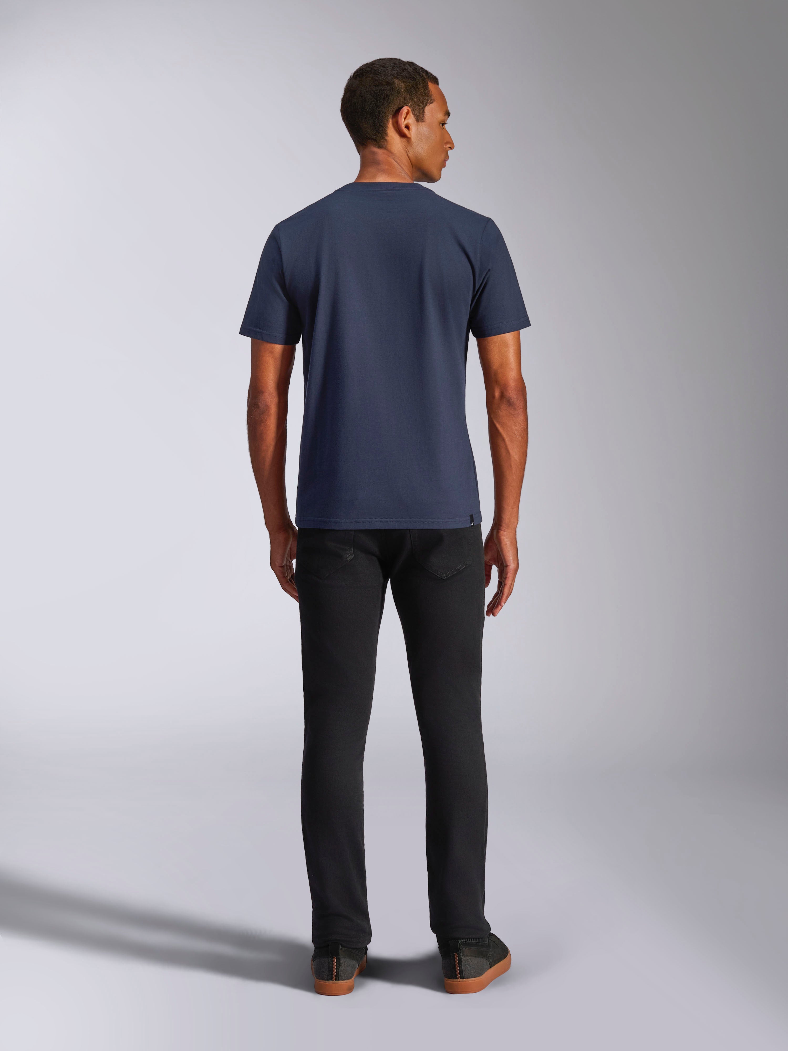 Alpinestars Ride 4.0 CSF Tee, Short Sleeve T-Shirt, Navy, back view on model, paired with black jeans, casual motorsport-inspired streetwear