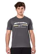 Alpinestars Prevail CSF Tee, Charcoal Gray Short Sleeve T-Shirt, white Alpinestars logo with yellow and white stripes and 'Premium Racewear' graphic, casual motorsport-inspired streetwear