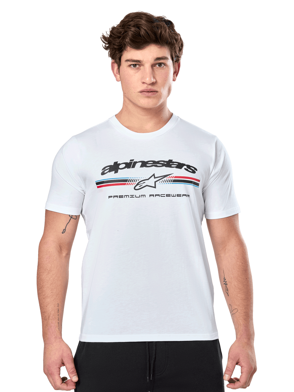 Alpinestars Prevail CSF Tee, White Short Sleeve T-Shirt, featuring a front paddock-style tri-color stripe logo with red and blue accents, black Alpinestars branding, and 'Premium Racewear' text, worn by a male model, casual motorsport apparel