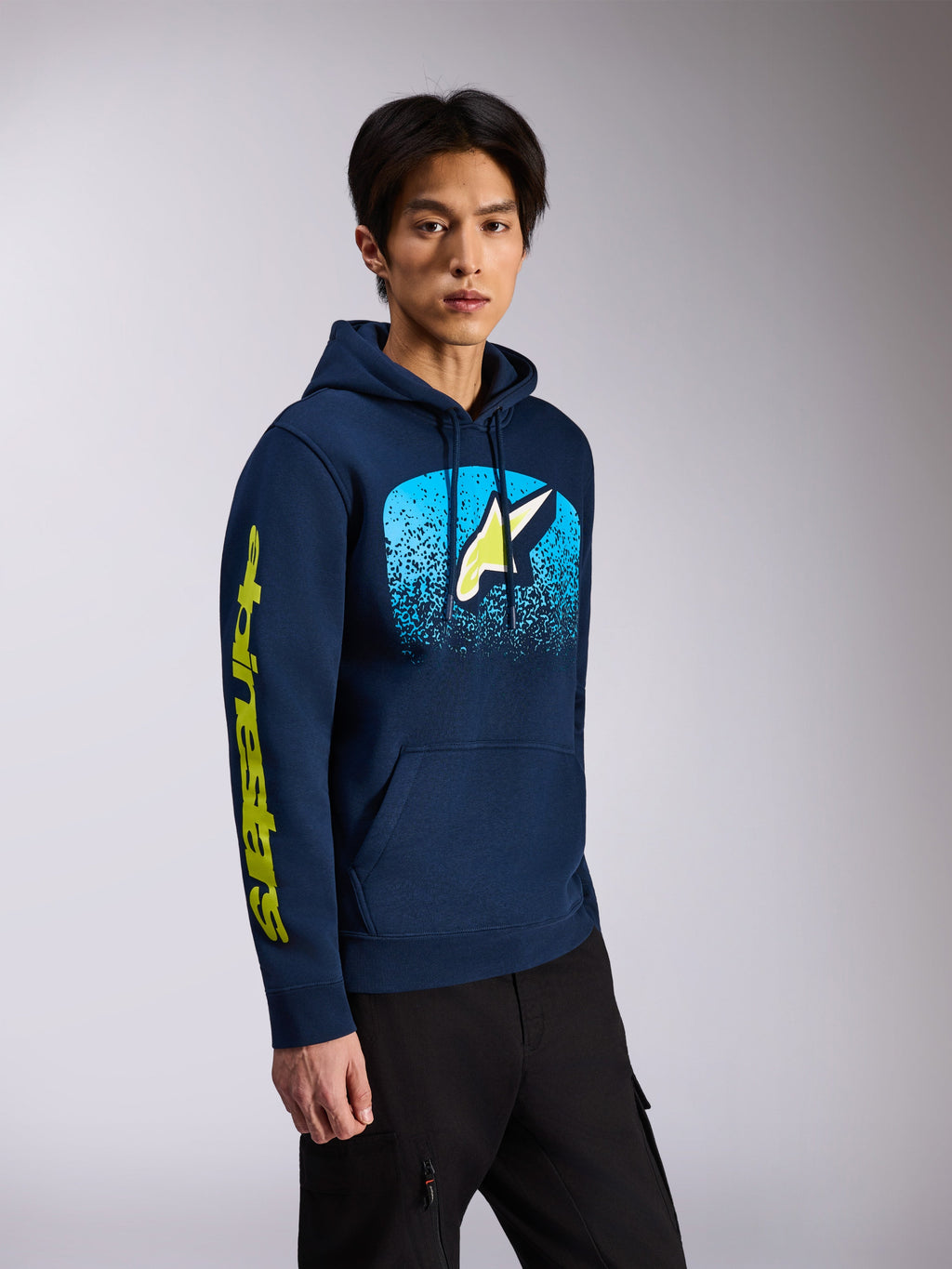 Alpinestars Obsessed Hoodie, Navy Blue, pullover fleece hoodie, featuring front Astars logo with light blue MX gradation and yellow wordmark on the sleeve, drawstring hood, casual motorsport streetwear