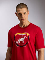 Alpinestars Plate CSF Tee, Short Sleeve T-Shirt, Red, featuring a front MX plate graphic with Alpinestars logo and 'Racing Ahead' text, worn by a male model, casual motorsport-inspired sportswear