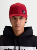 Alpinestars Pivot Hat, Dark Red Sportswear Baseball Cap, Unisex, front view on model featuring the embroidered Astars logo patch, curved bill, structured crown, and durable twill construction.