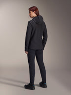 Alpinestars Stella A-Dura Thermal Jacket, Women's MTB cycling jacket, Black, back view highlighting the insulated hood and regular fit, worn with matching black pants and shoes, lightweight thermal insulation for cold-weather riding
