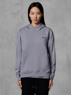 Alpinestars Essentials Ageless Hoodie, casual sportswear, silver with small black logo, kangaroo pocket, hooded pullover, worn by model, modern lifestyle apparel