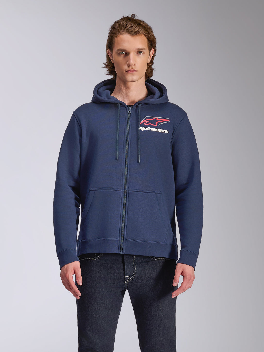 Alpinestars Formulation Hoodie, navy blue full-zip fleece hoodie, features large chest logo with red and white accents, mesh-lined hood with drawcords, casual motorsport-inspired streetwear