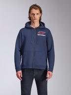 Alpinestars Formulation Hoodie, navy blue full-zip fleece hoodie, features large chest logo with red and white accents, mesh-lined hood with drawcords, casual motorsport-inspired streetwear
