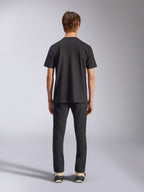 Alpinestars Fasting CSF Tee, Short Sleeve T-Shirt, Black, rear view on model, worn with black pants and sneakers, casual motorsport-inspired streetwear
