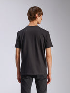 Alpinestars Harken CSF Tee, Short Sleeve T-Shirt, Black, back view of model wearing casual motorsport-inspired streetwear, simple black design, short sleeves, paired with black pants