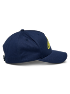 Alpinestars Ageless Snapback Hat, Navy Blue and Hi-Vis Yellow, side view showing curved bill and structured crown, front linear logo in yellow 3D embroidery, casual sportswear accessory with adjustable snapback closure