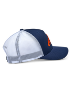 Alpinestars Ageless Trucker Hat, side profile view, Navy Blue and White, featuring a navy twill front and bill with breathable white mesh back, orange 3D embroidered Astars logo, casual motorsport-inspired headwear