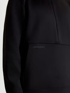 Alpinestars Apera Half-Zip Sweatshirt, Sportswear Pullover for Men and Women, Black, close-up showing the tonal HD logo print on the kangaroo pocket and half-zip design, premium tri-blend fleece construction.