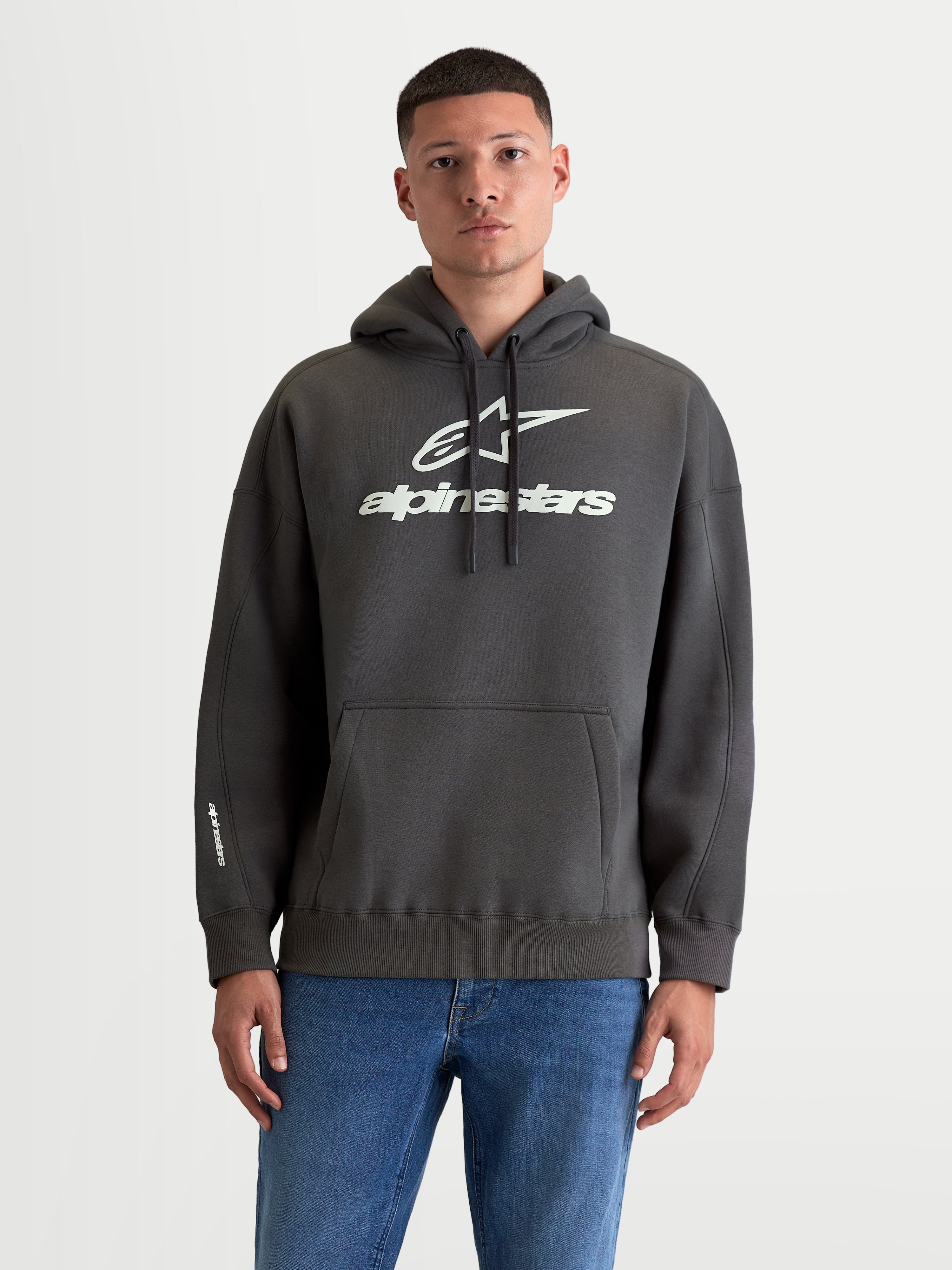 Alpinestars Prelude Oversized Hoodie, Men's Sportswear Fleece Pullover, Charcoal Gray and White, Cotton and Recycled Polyester, features a relaxed oversized fit, kangaroo pocket, and bold puff-print logos on chest and sleeve.