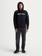 Alpinestars Race Wordmark Hoodie, Casual Sportswear Pullover Fleece for Men and Women, Black and White, featuring the front Race Linear Word Logo and Ageless sleeve logo, comfortable cotton-blend construction with a kangaroo pocket and adjustable hood.