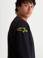 Alpinestars Velocifier CSF Tee, Men's Long Sleeve Sportswear T-Shirt, Black with a Vibrant Yellow Astars Logo on the Shoulder, Close-up View, Motorsport-Inspired Casual Wear.