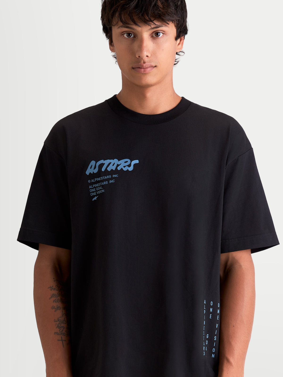 Alpinestars Chalk Oversized CSF Tee, Men's Sportswear T-Shirt, Black with Light Blue Graphics, features a relaxed oversized fit, soft-hand front Astars word logo, and side text branding, comfortable cotton/polyester blend for everyday casual wear.