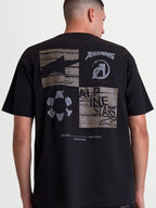 Alpinestars Checkback Oversized CSF Tee, Black Sportswear T-Shirt, back view on model showing a large grey graphic with Astars logos, Alpinestars text, and 'One Goal One Vision' slogan. Oversized fit, soft-hand print, cotton-polyester blend.