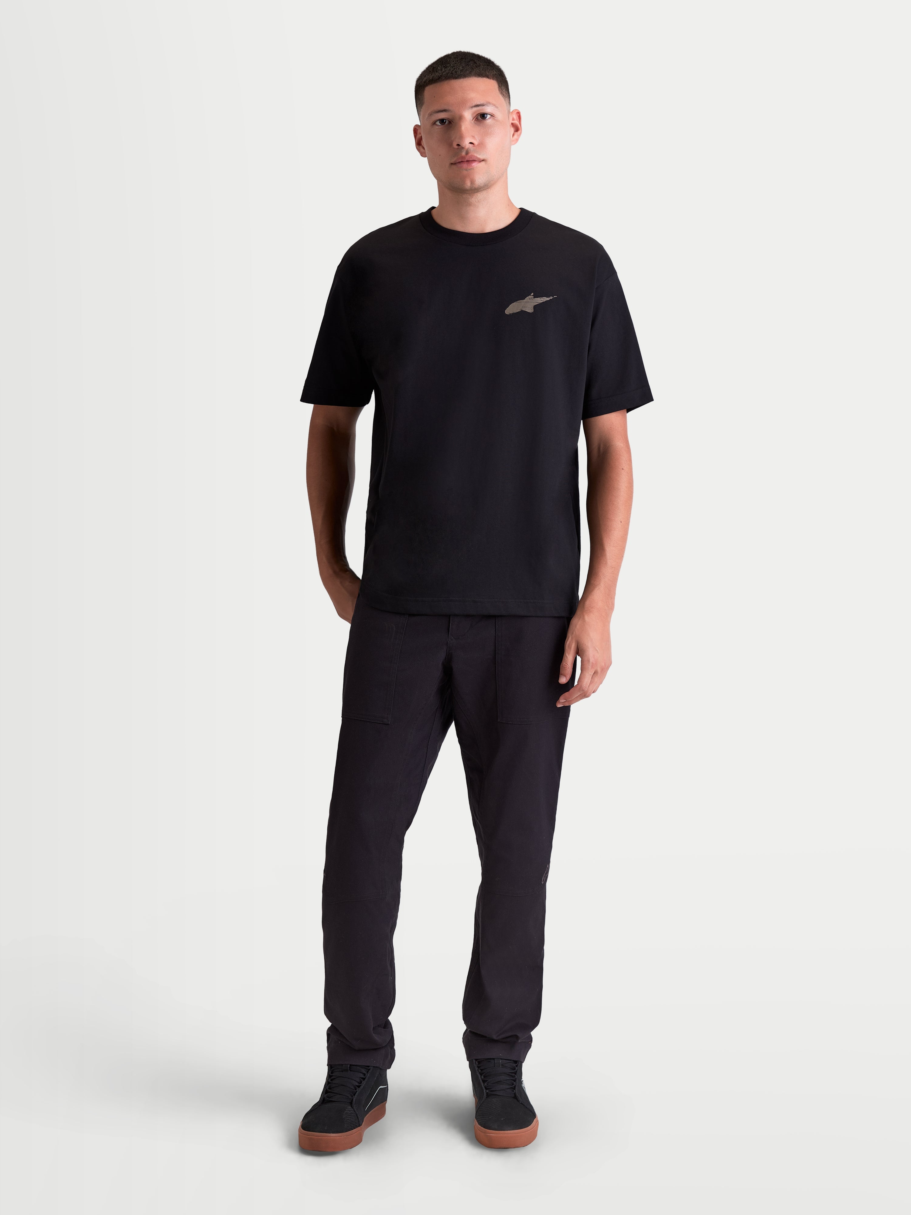 Alpinestars Checkback Oversized CSF Tee, Men's Short Sleeve Sportswear T-Shirt, Black, oversized relaxed fit with a front Astars logo, soft cotton-polyester blend material, casual motorsport-inspired lifestyle apparel, full-length on-model view.