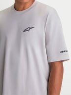 Alpinestars Mandate Oversized CSF Tee, Men's and Women's Short Sleeve Sportswear T-Shirt, Cement Gray, featuring a black puff-print Astars logo on the chest and wordmark graphic on the sleeve, oversized fit for casual comfort.