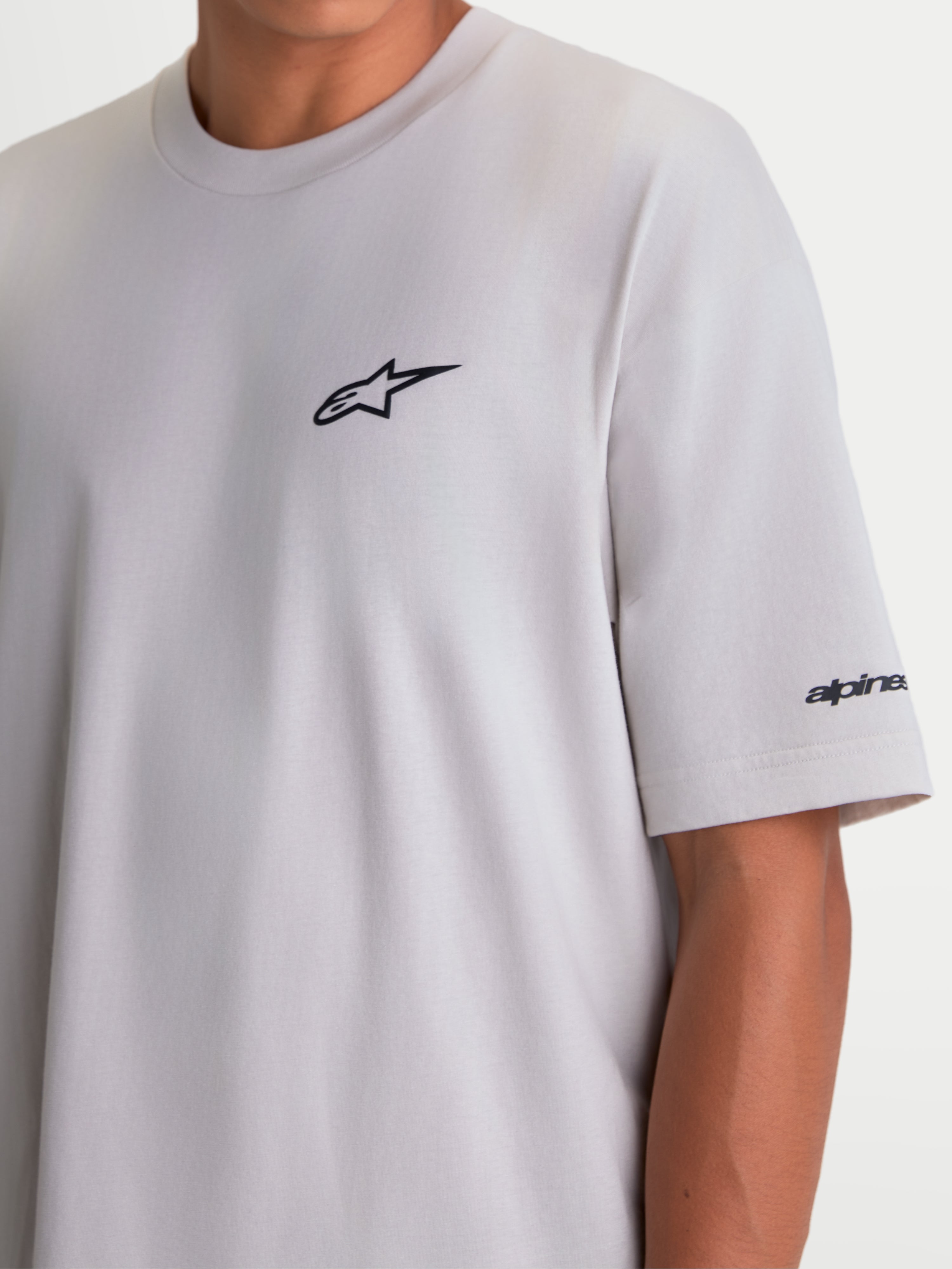 Alpinestars Mandate Oversized CSF Tee, Men's and Women's Short Sleeve Sportswear T-Shirt, Cement Gray, featuring a black puff-print Astars logo on the chest and wordmark graphic on the sleeve, oversized fit for casual comfort.