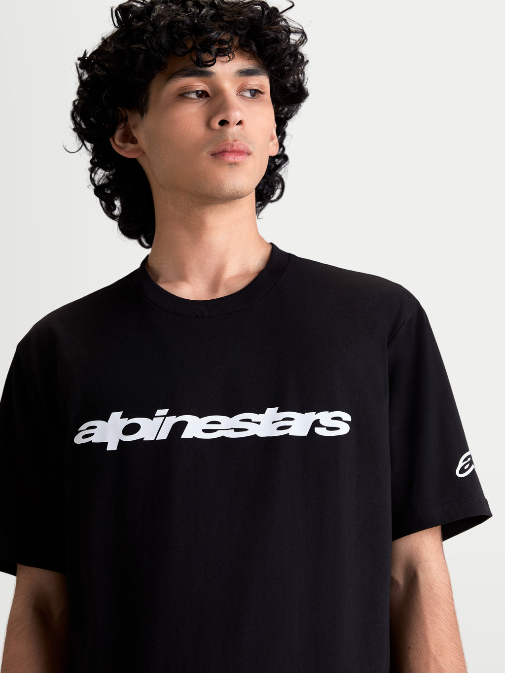 Alpinestars Race Wordmark CSF Tee, Men's Short Sleeve Sportswear T-Shirt, Black and White, featuring a bold front wordmark graphic and sleeve ageless logo, soft combed ring-spun cotton-poly blend for everyday comfort.