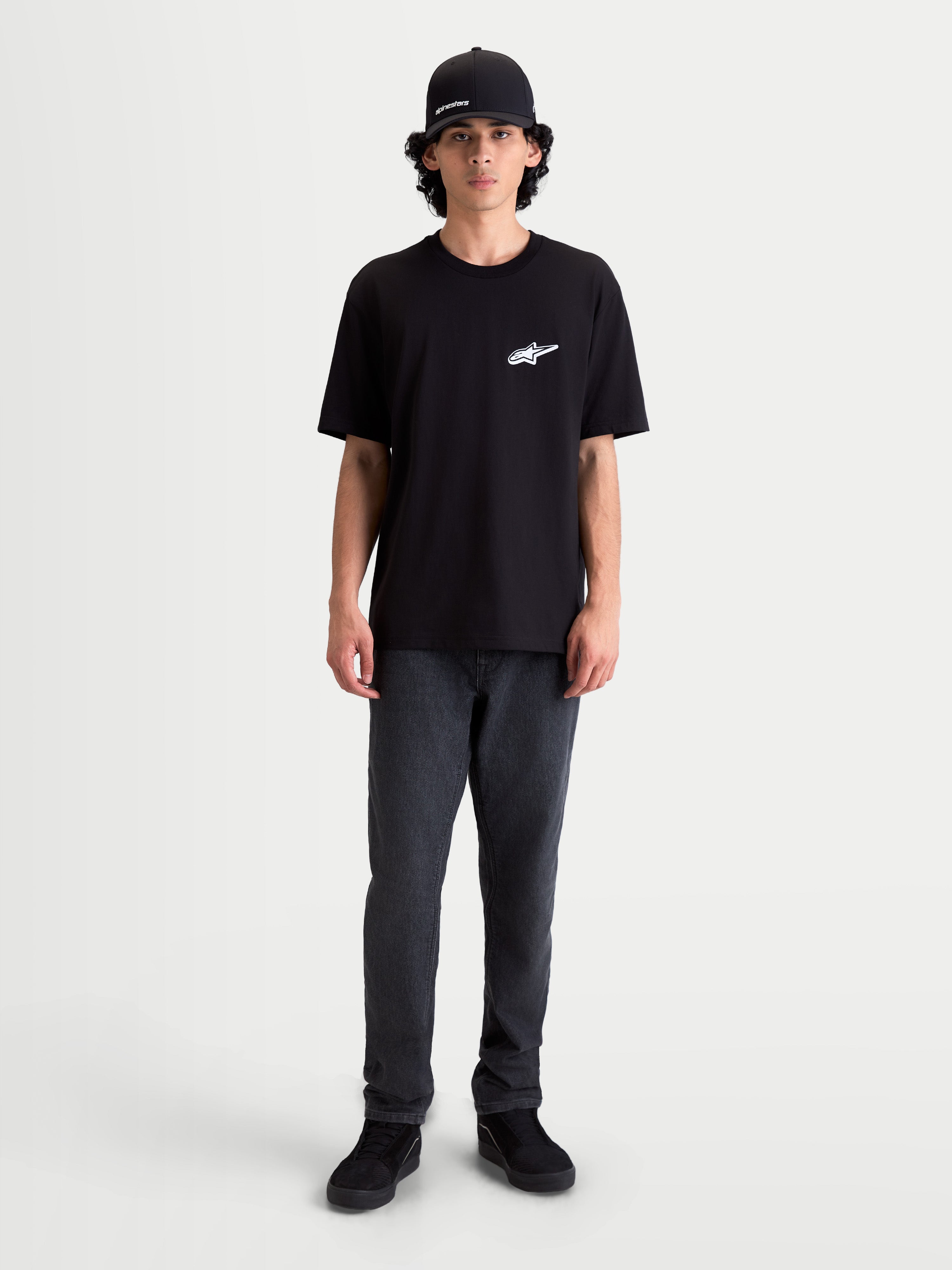 Alpinestars Meteor CSF Tee, Men's Short Sleeve Sportswear T-Shirt, Black with white Astars chest logo, premium cotton-poly blend, lifestyle on-model view.