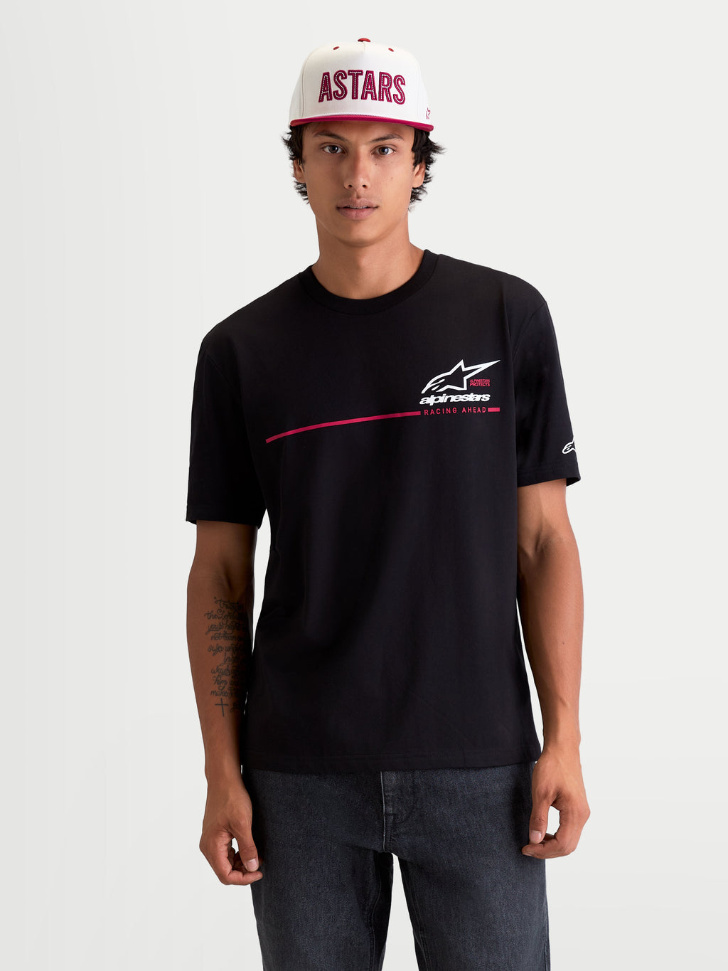 Alpinestars P1 CSF Tee, Men's Short Sleeve Sportswear T-Shirt, Black with White and Red Race Stripe Logo Graphic, 60/40 Cotton-Poly Blend, Casual Motorsport Lifestyle Apparel worn by model.