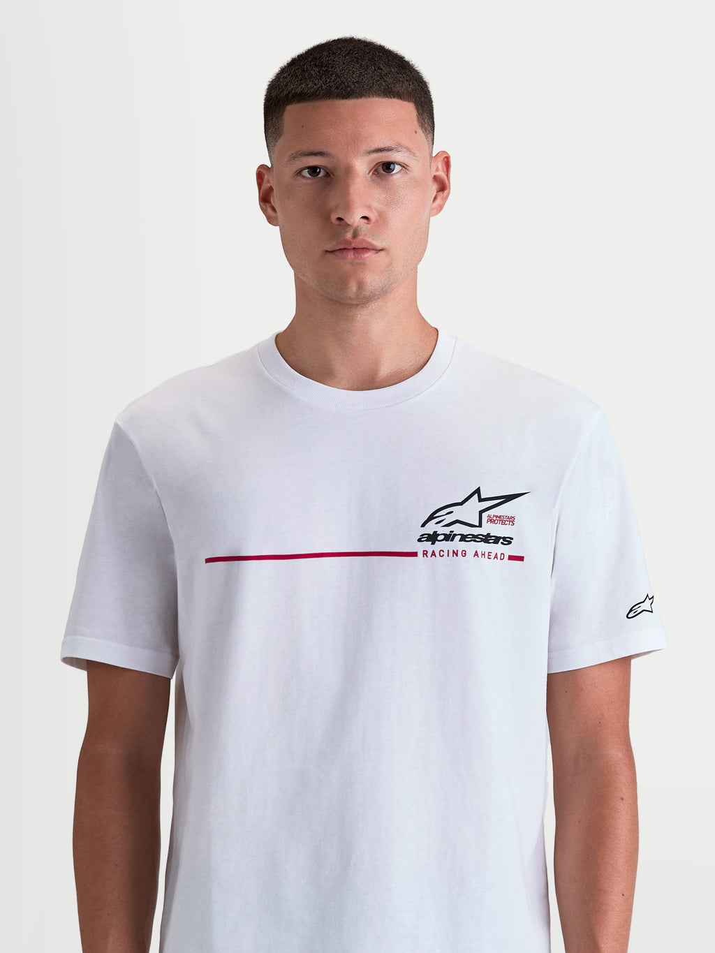 Alpinestars P1 CSF Tee, Short Sleeve Sportswear T-Shirt for Men and Women, White featuring a Black and Red Race Stripe Graphic and Racing Ahead text, soft Cotton-Poly blend construction for casual comfort.