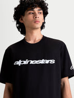 Alpinestars Race Wordmark CSF Tee, On-Model Casual Sportswear T-Shirt, Black and White, featuring a bold front wordmark graphic and sleeve Ageless logo, 60/40 cotton-poly blend for everyday comfort.