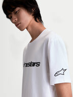 Alpinestars Race Wordmark CSF Tee, White and Black Casual Sportswear Short Sleeve T-Shirt, featuring a bold front wordmark and Ageless star logo on the sleeve, soft-hand graphic print, cotton-poly blend, on-model side view.