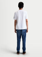 Alpinestars Race Wordmark CSF Tee, back view on model, white short sleeve sportswear t-shirt with black Ageless logo on the sleeve, soft cotton-poly blend lifestyle apparel.