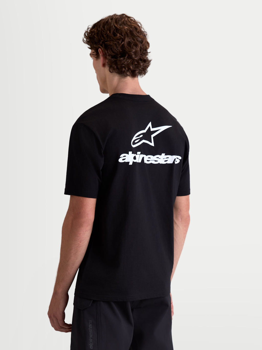 Alpinestars Combo Back CSF Tee, Short Sleeve Sportswear T-Shirt, Black and White, Rear View with Large Astars Logo and Wordmark Graphic, Premium Cotton-Poly Blend, Casual Motorsports Apparel.