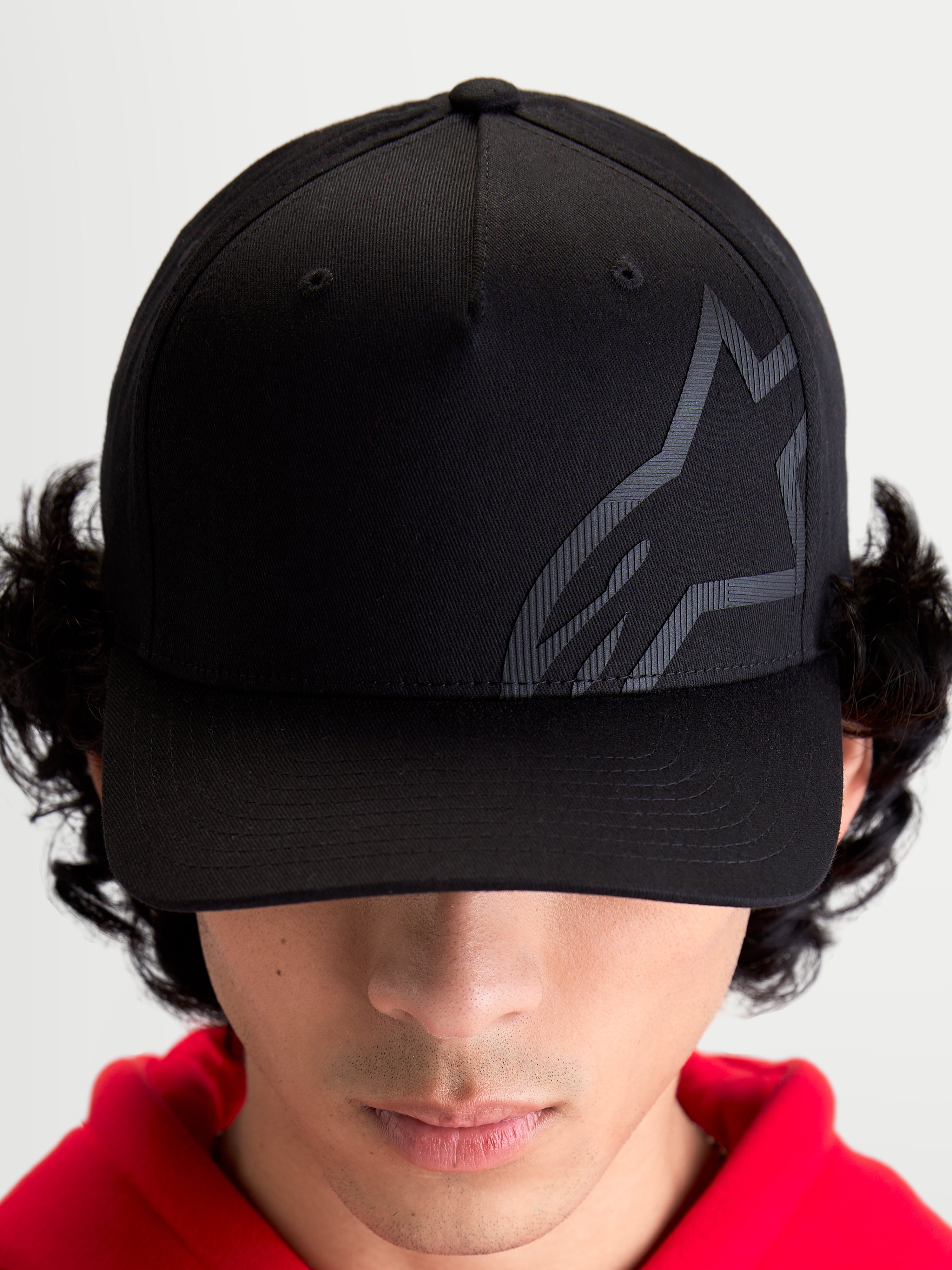 Alpinestars Maze Hat, Motorsport-Inspired Sportswear Baseball Cap, Unisex, Black, Twill Fabric with Structured Crown, Curved Bill, and Textured Tonal Astars Corp Shift Logo, On-Model Front View.