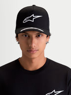 Alpinestars Arclight Hat, Black and White Motorsport Sportswear Cap, on-model front view. Features a white puff-print Astars logo on a structured crown, curved bill with logo detailing, and premium twill fabric.