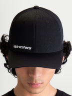 Alpinestars Points Hat, Black Curved Bill Sportswear Cap on Model, featuring White Alpinestars Word Logo on front, Lightweight Nylon Tactel Construction.
