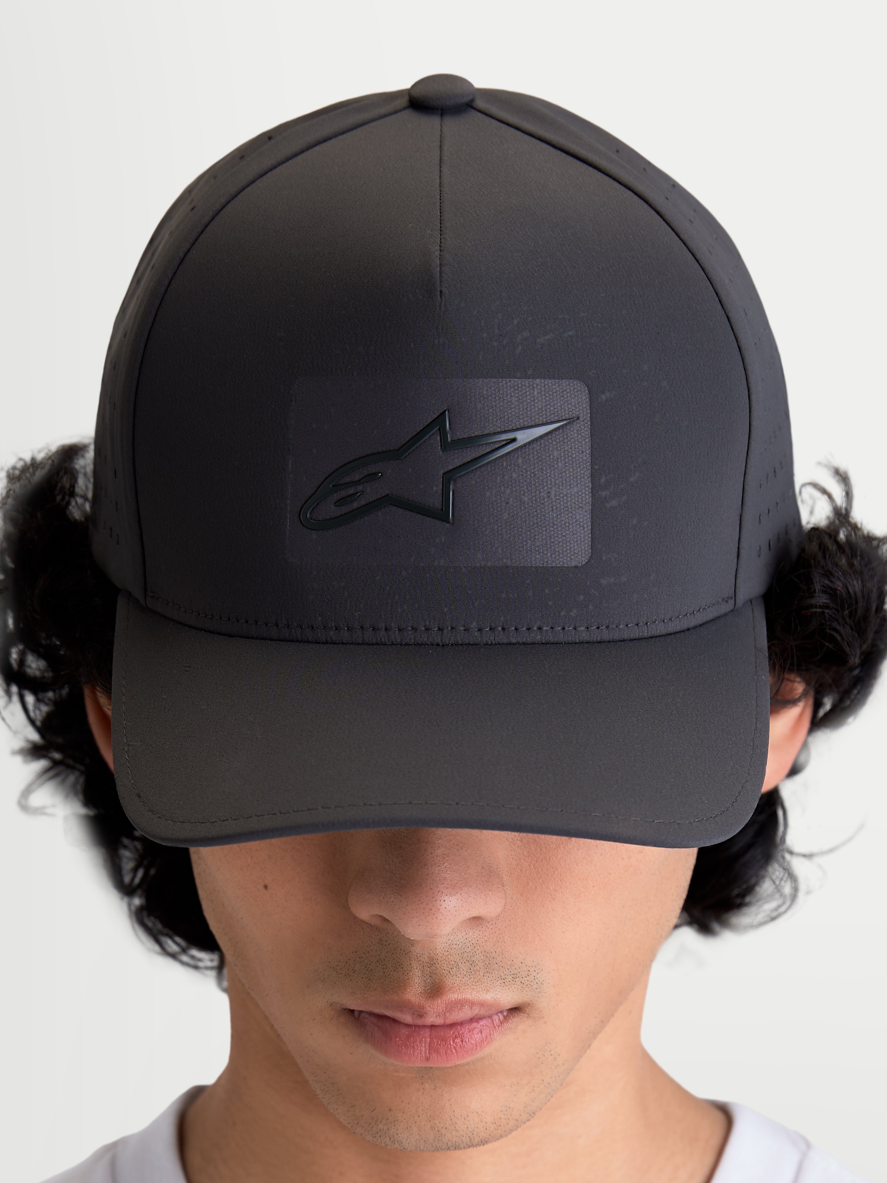 Alpinestars Algo Perf Adjustable Hat, Sportswear Baseball Cap, Dark Grey, featuring a structured crown, curved bill, and sonic-weld Astars logo with breathable side perforations, on-model front view.