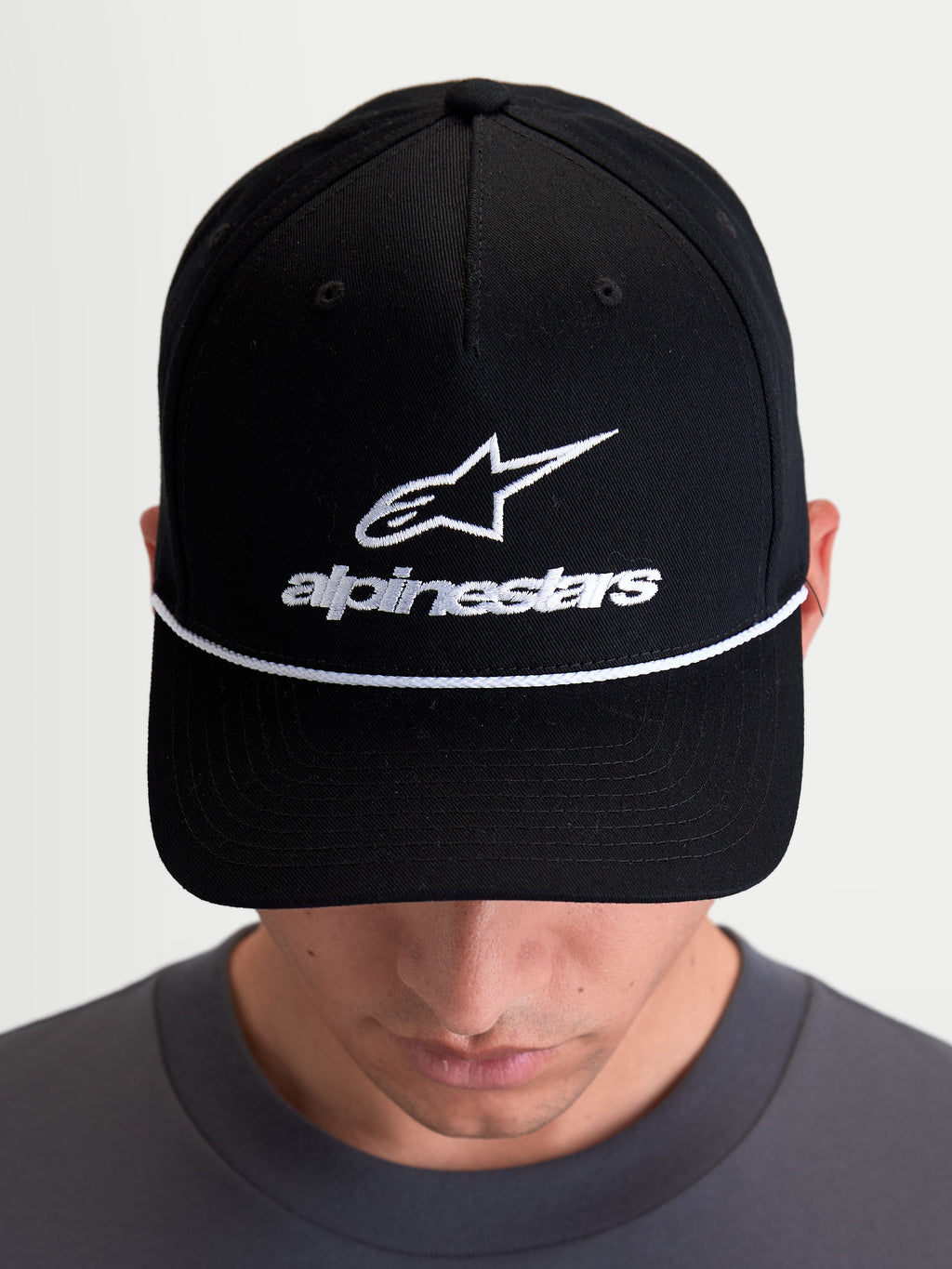 Alpinestars Combo Logo Snapback Hat, Casual Sportswear Cap, Unisex, Black and White, featuring a structured crown, curved bill with white decorative rope, and front Astars logo embroidery, premium cotton twill construction.