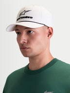 Alpinestars Combo Logo Snapback Hat, Men's Sportswear Baseball Cap, Off White and Black, on-model view featuring front Astars combo logo embroidery, curved bill, and structured crown, 100% cotton twill construction for a premium motorsport look.