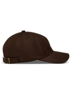 Alpinestars Dylan Dad Hat, brown twill sportswear cap, side view with unstructured low crown, curved bill, and strap back.