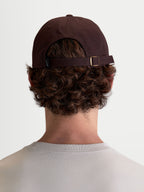 Alpinestars Dylan Dad Hat, Brown Casual Sportswear Cap, 100% Cotton Twill, featuring an adjustable strap-back closure and unstructured low crown, rear view on-model.