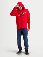 Alpinestars Ageless Zip V3 Hoodie, Red and White, Men's Full-Zip Sportswear Fleece on model, featuring a white Alpinestars chest logo, hood with drawcords, and ribbed cuffs. Ideal for casual motorsport fans.