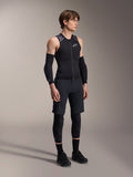 Alpinestars A-Motion Plasma Protection Vest, Sleeveless Black and Camo MTB Protection Vest, full body view of model wearing vest with arm sleeves and knee pads, zippered front with white Alpinestars logo, high-performance gear for mountain biking