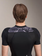 Alpinestars A-Motion Plasma Protection Jacket - Short Sleeve, Back view of upper torso, Black with Grey Camo panel across shoulders featuring Alpinestars logo, breathable stretch mesh construction for MTB protection