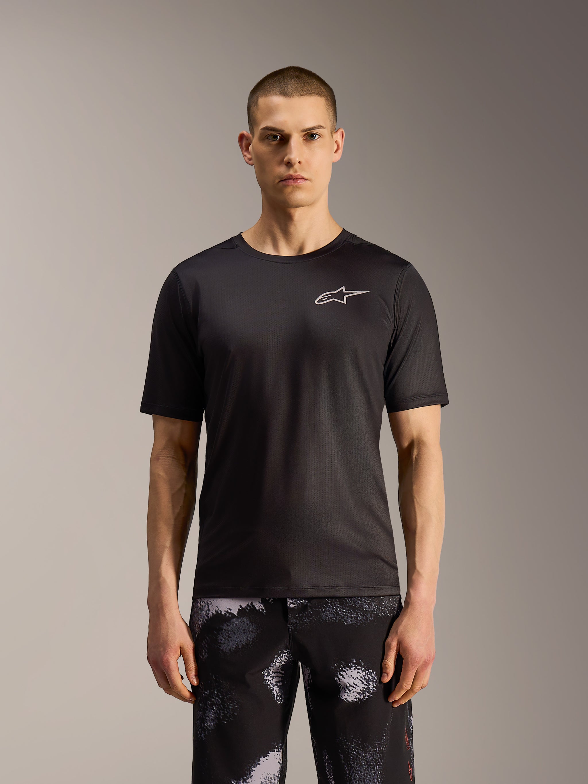A-Dura Ride Shorts in Black Camo, durable MTB shorts featuring a rugged pattern, shown on a model.
