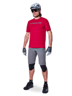 Alpinestars A-Aria Elite Shorts, Men's Dark Gray MTB shorts with 4-way stretch fabric, on model with red cycling gear.