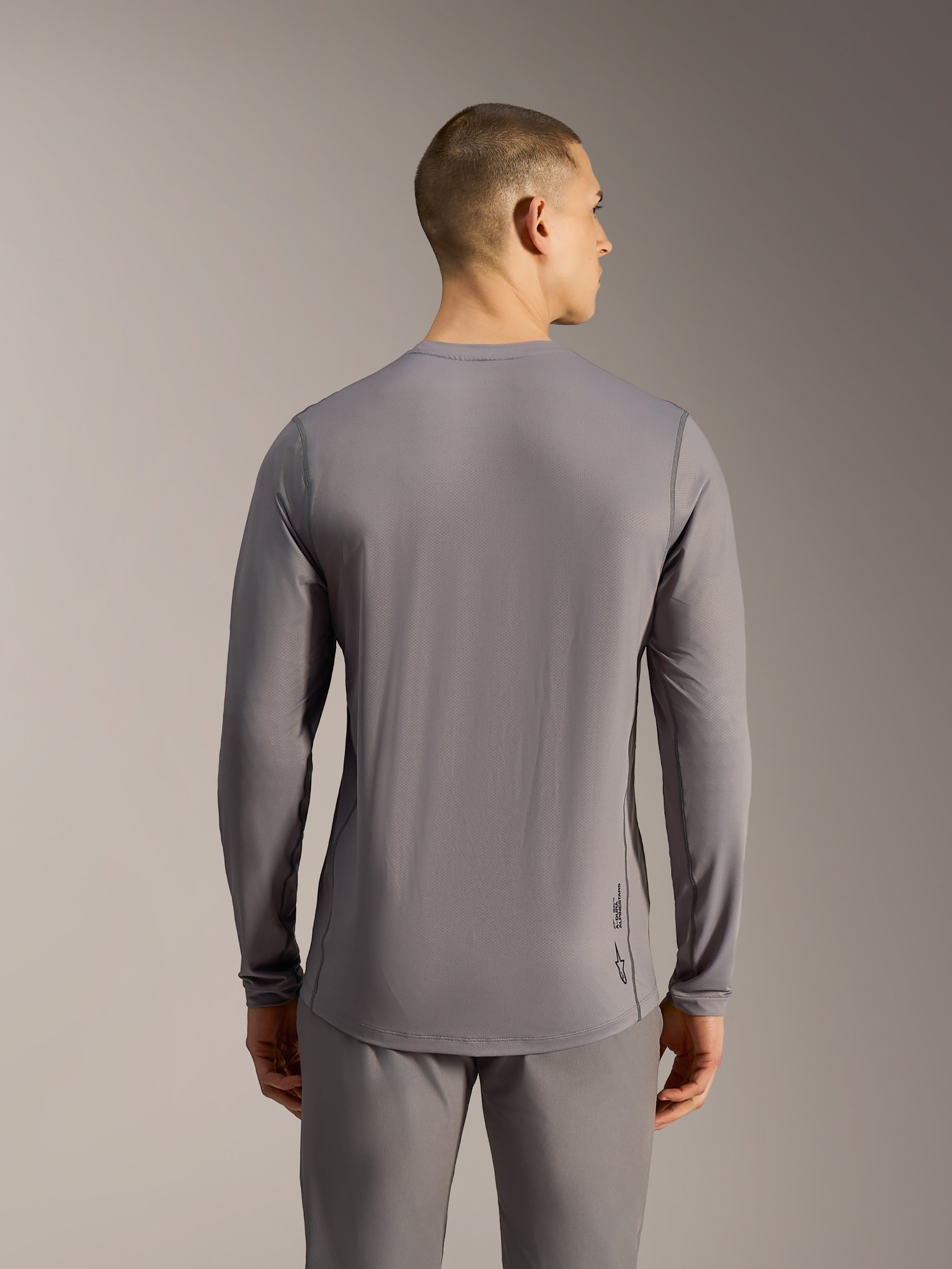 A-Dura Ride Long Sleeve Jersey in Gray, performance MTB jersey with jacquard stretch fabric and a dropped tail.