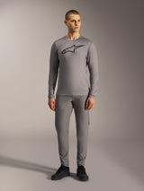 Alpinestars A-Dura Ride Long Sleeve Jersey in Gray, featuring a large black chest logo, worn with matching MTB pants.