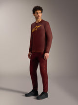 Bordeaux A-Dura Ride Long Sleeve Jersey with yellow Astars logo, styled with matching pants and black cycling shoes.