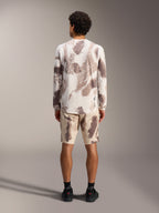 Alpinestars A-Dura Ride LS Jersey and matching shorts in sand camo pattern, styled as a complete MTB outfit, rear view.